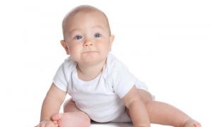 At what months does a baby begin to sit?